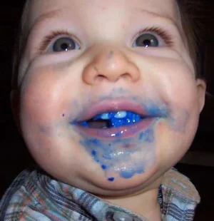 kid-eating-blue-crayon.webp
